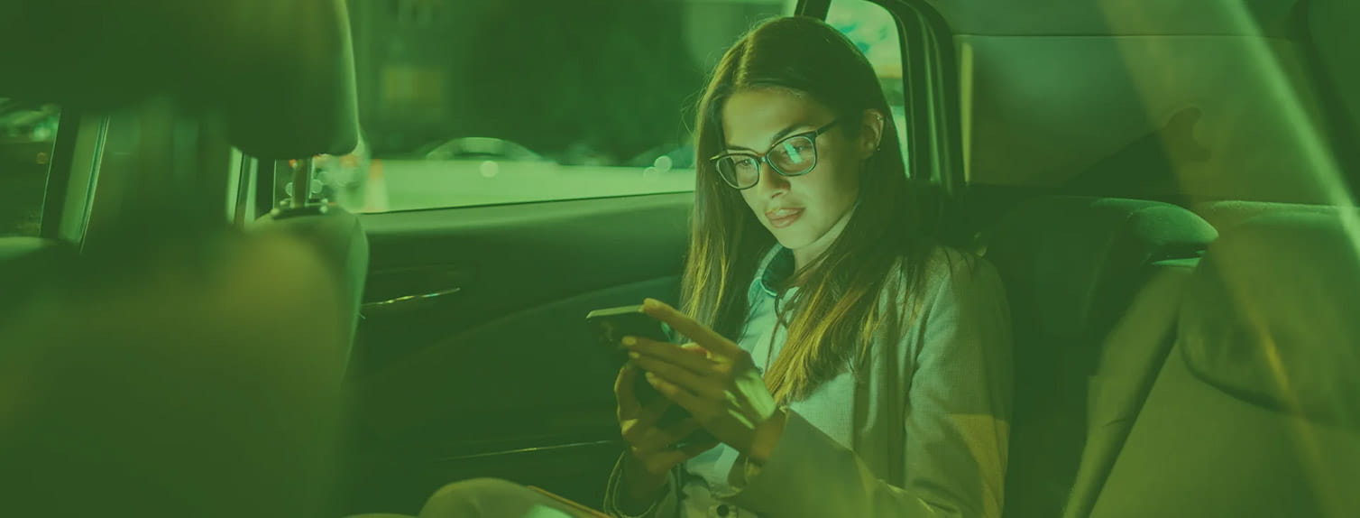 Young professional woman in a taxi