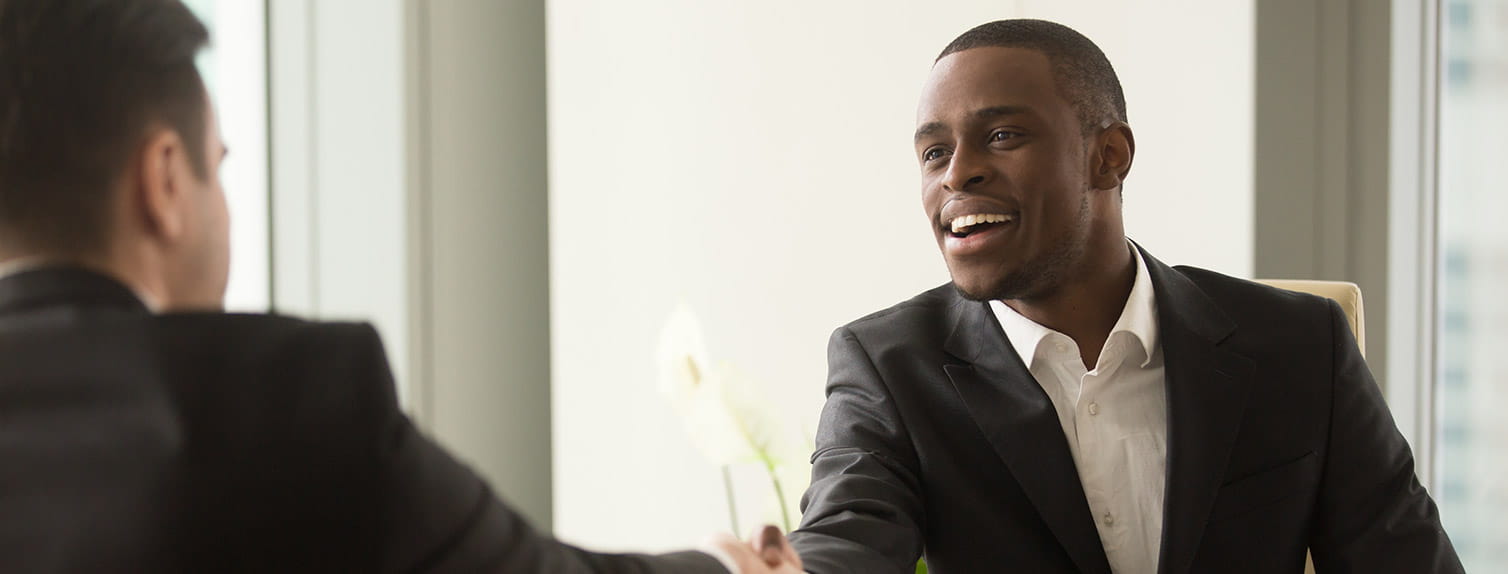 Business professionals shaking hands