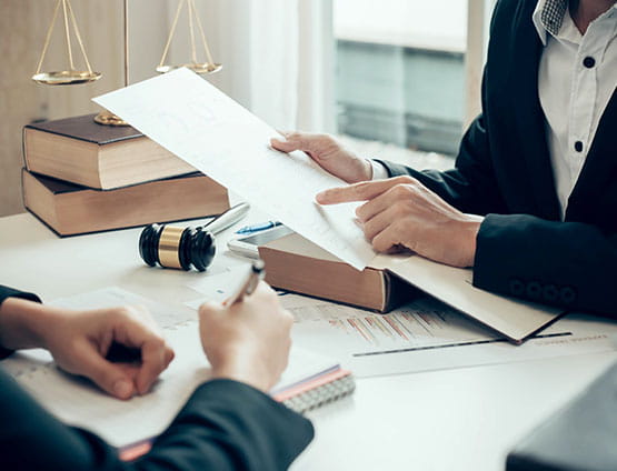 Working on court documents to perform an expert report