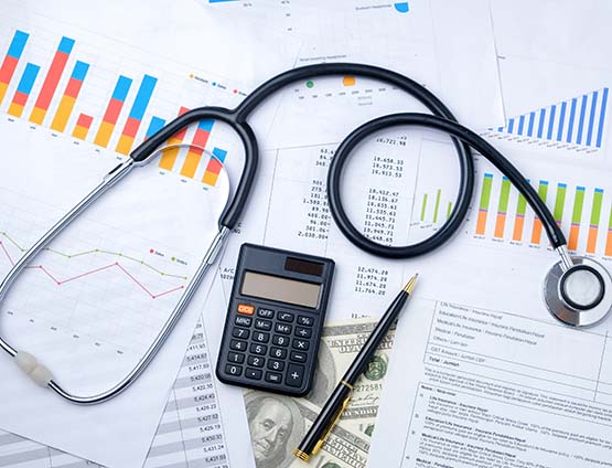 Image of Stethoscope financial documents and calculator