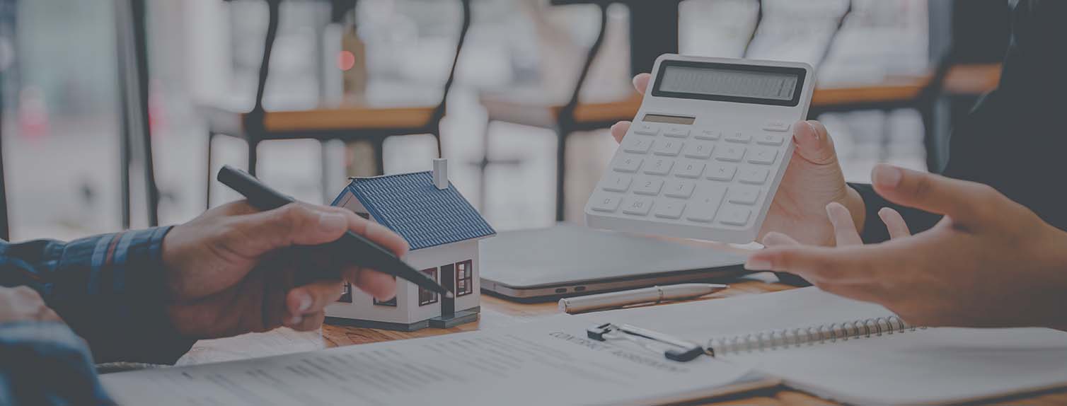 two people's hands gesturing over financial documents