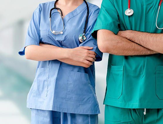 doctor and nurse standing with arms crossed in the hospital