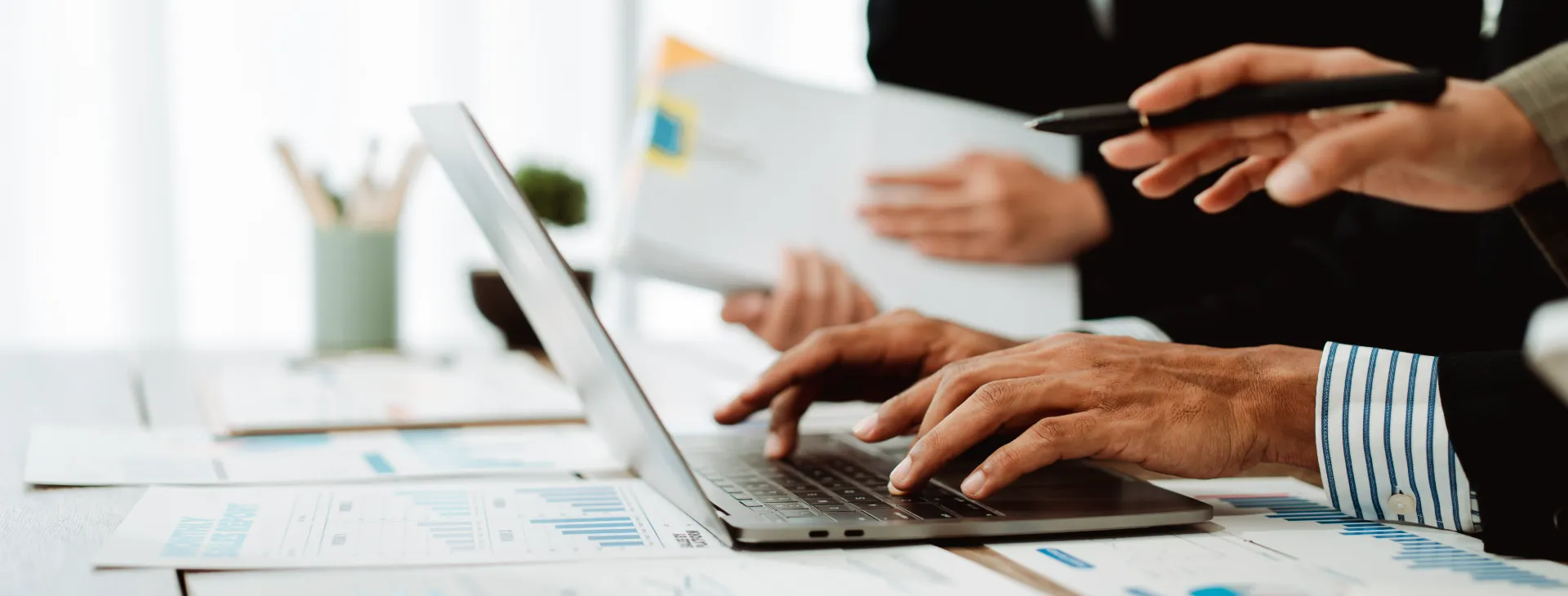 finance professionals reviewing reports