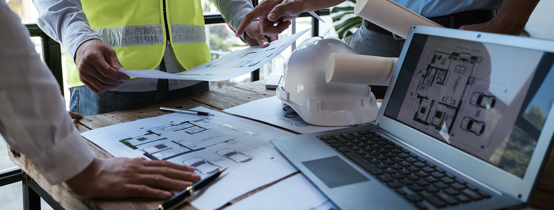 professionals reviewing construction drawings