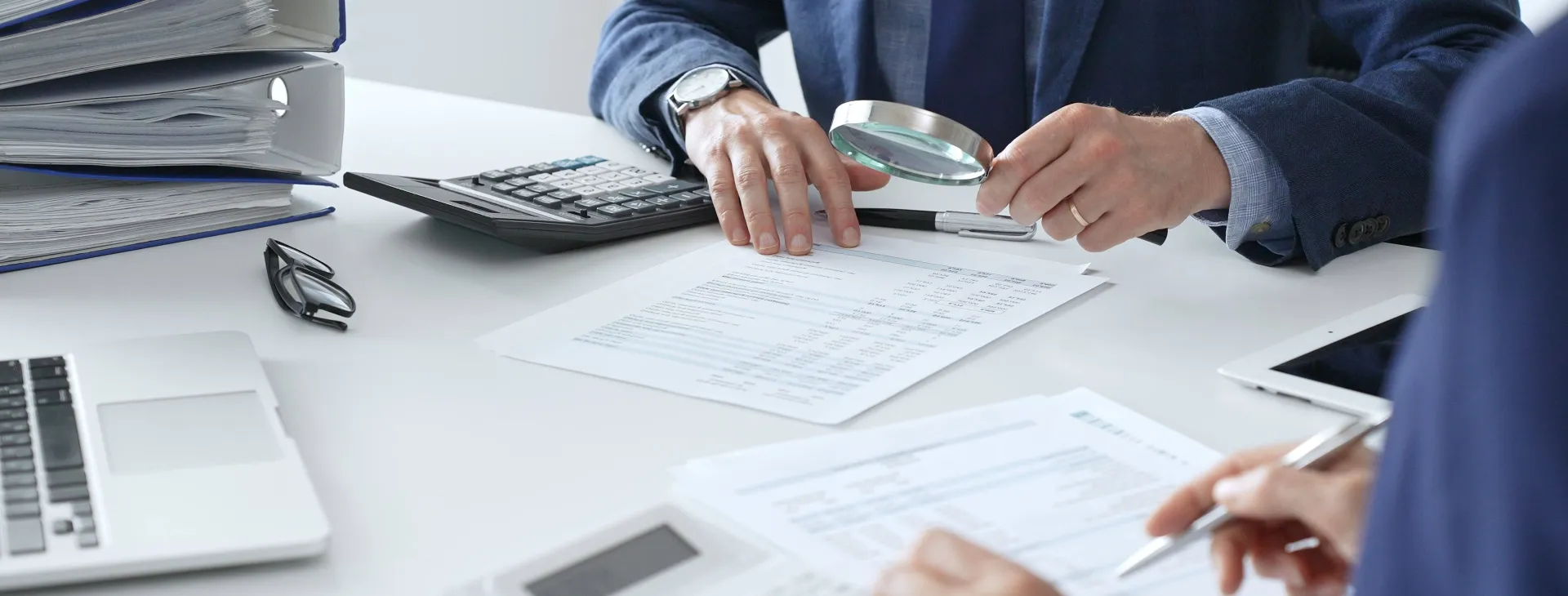 financial analysts examining documents