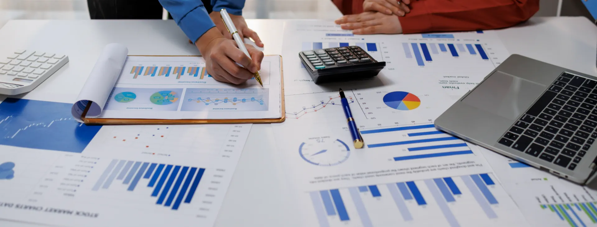 business professionals analyzing graphs of company's financial performance