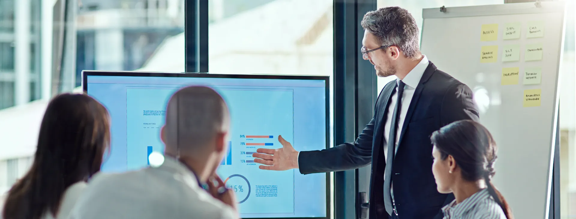 team of businesspeople reviewing financial charts