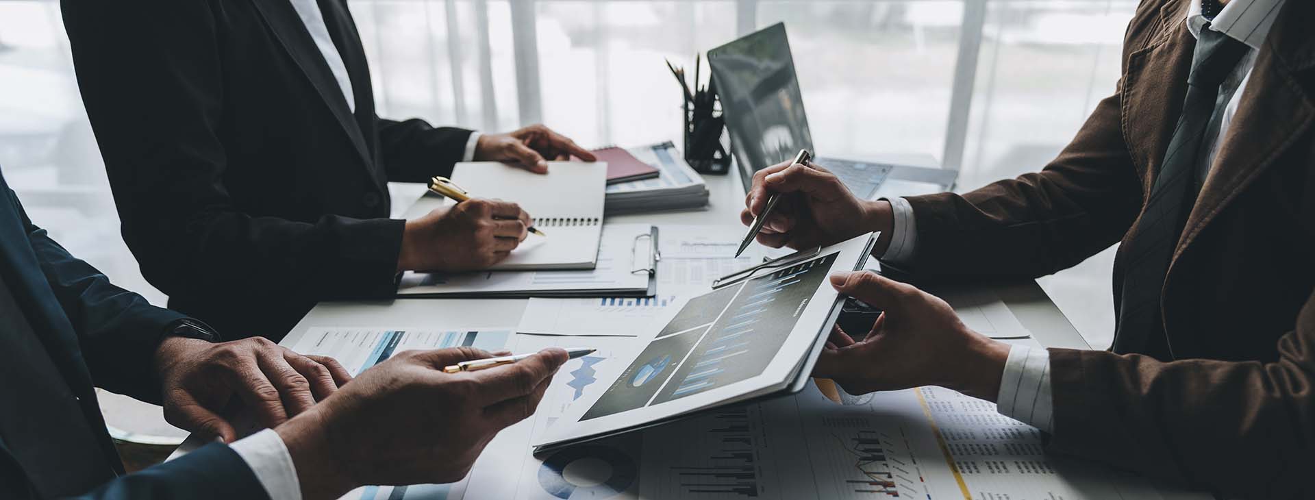 professionals reviewing financial reports