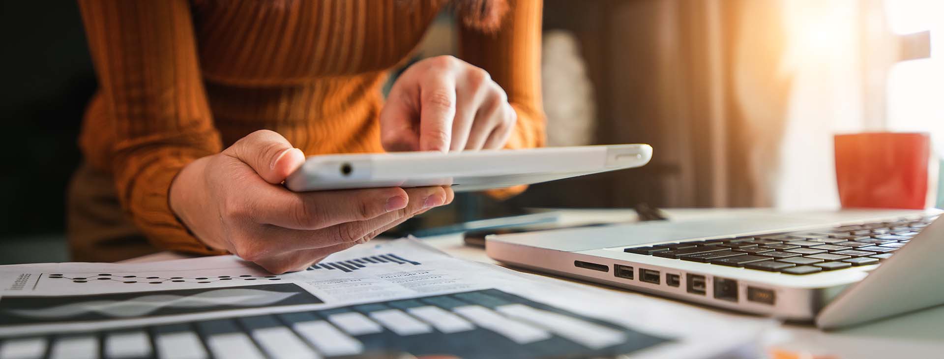 Businesswoman working on digital marketing media in and office with mobile phone and laptop