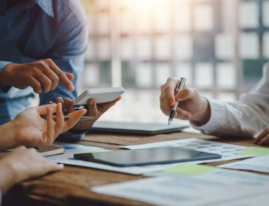 Business professionals reviewing data results