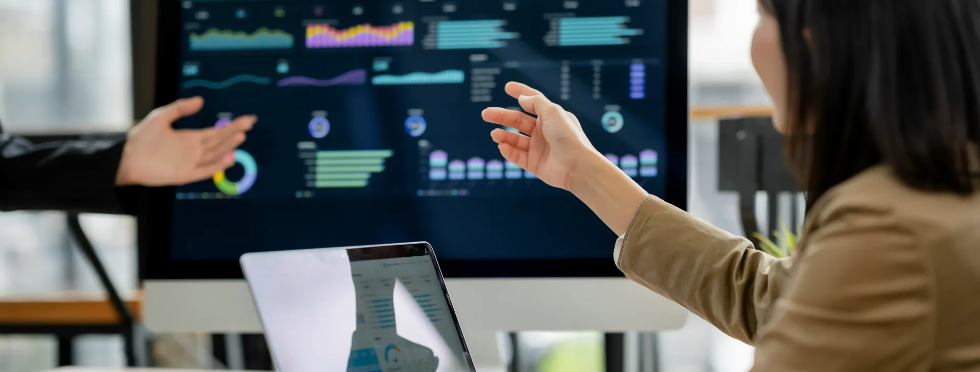 business people reviewing financial reports on a computer
