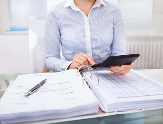 Businessperson reviewing accounting transactions