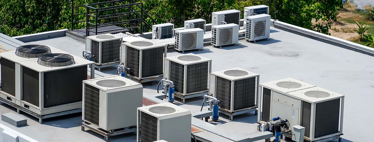 air conditioning units on the roof of a commercial building