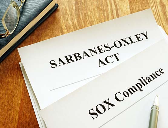Sarbanes-Oxley Act and SOX compliance policy on table
