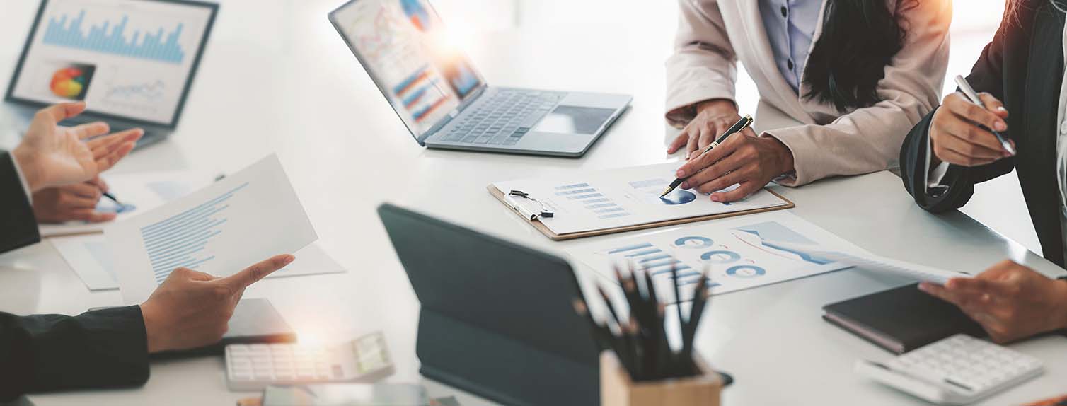 coworkers working together in boardroom discussing business strategy