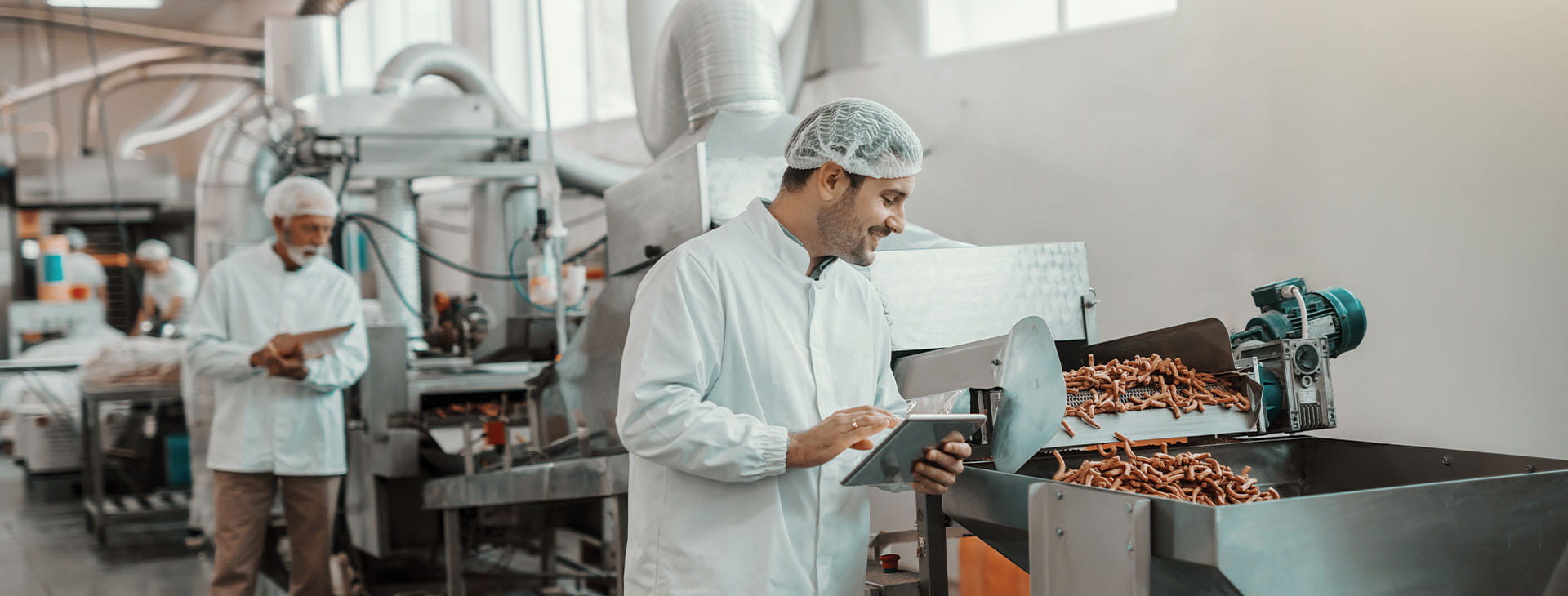 image of food warehouse inspectors looking at machinery
