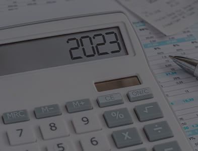 view of calculator over accounting documents