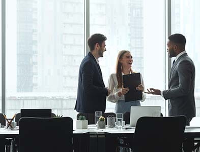Businesspeople talking in office conference room