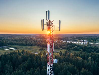 Mobile communication tower during sunset from above