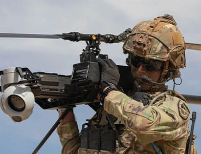 U.S. Army Staff Sgt. Stetson Manuel carries the Ghost-X Unmanned Aircraft System during PC-C4 Phase 2