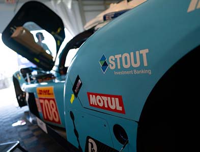 Image of race car with Stout Investment Banking logo