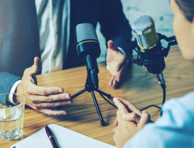 Two microphones set up for a recorded conversation.