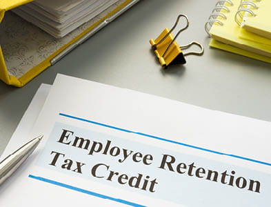 Employee retention tax credit papers and folder