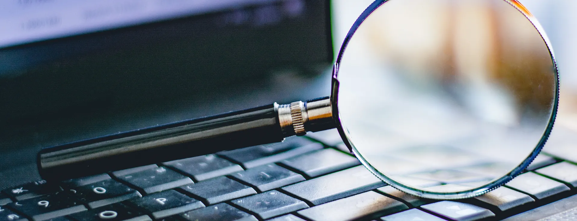 magnifying glass on keyboard